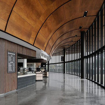 Curved Wooden Soffit in the UT Moody Center Arena from PARKLEX PRODEMA